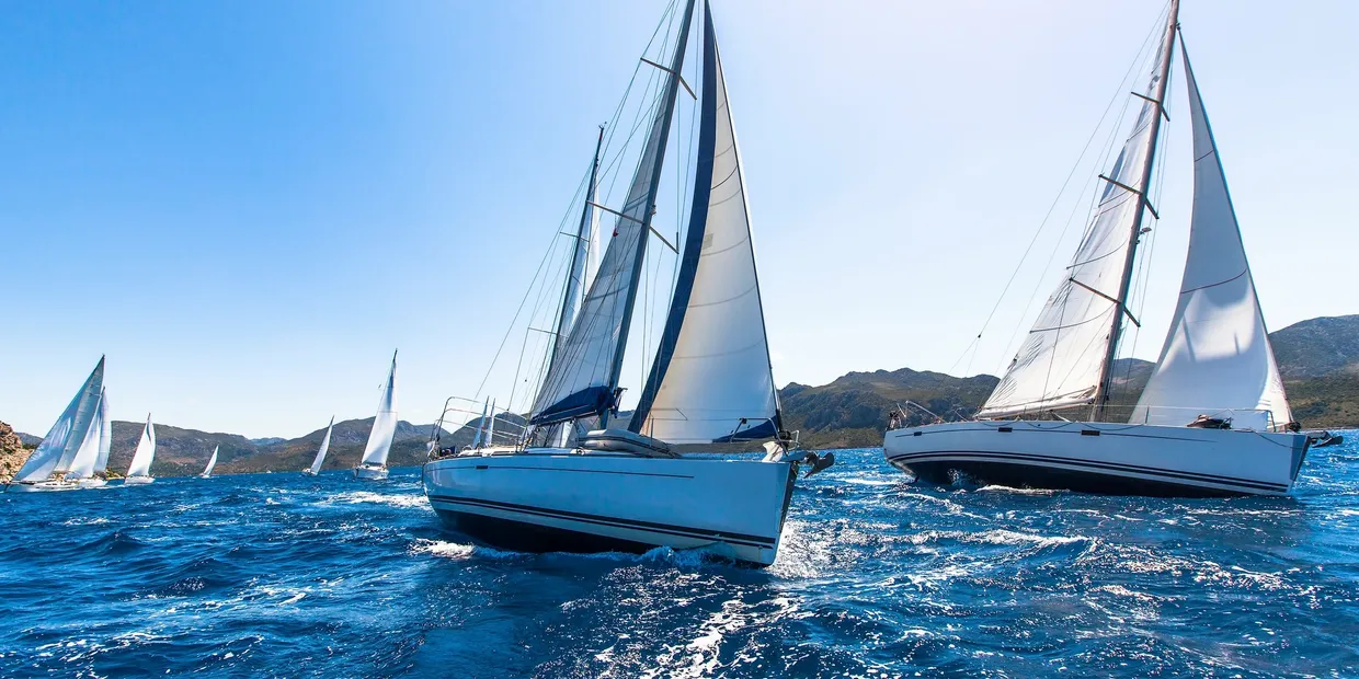 A picturesque scene of sailboats in the ocean, perfect for sailing vacations and courses in Zadar, Croatia.