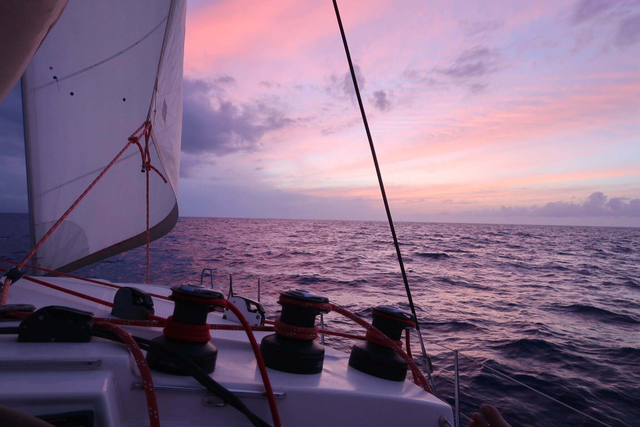 A sailboat gliding across the ocean at sunset, symbolizing adventure and tranquility in Zadar, Croatia's sailing courses and offshore sailing course.