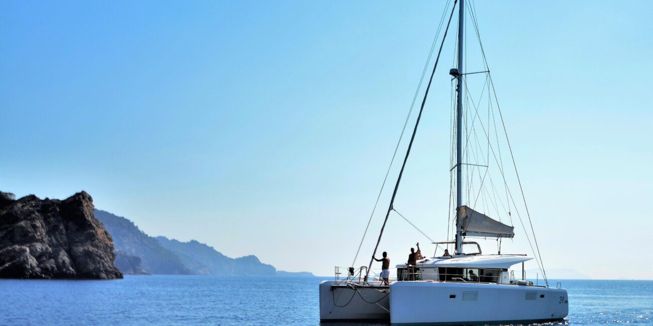 A catamaran gliding through the ocean, ideal for sailing courses and tours in Zadar, Croatia's stunning archipelago.